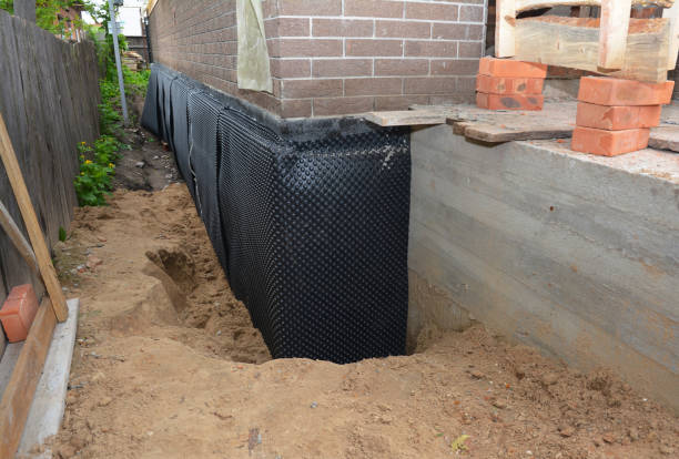 Happy homeowners after waterproofing job in Jenkintown